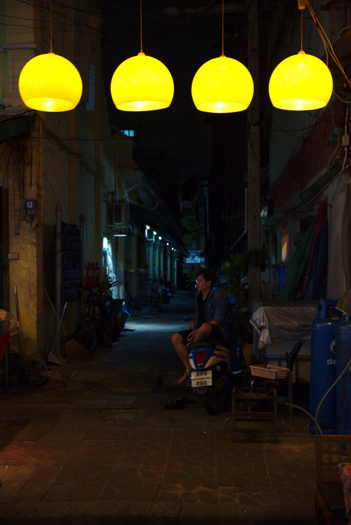 Yellow lamps in a night alley, Bangkok