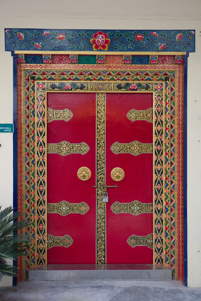 Red and gold painted doors, Dharamshala and McLeod Ganj