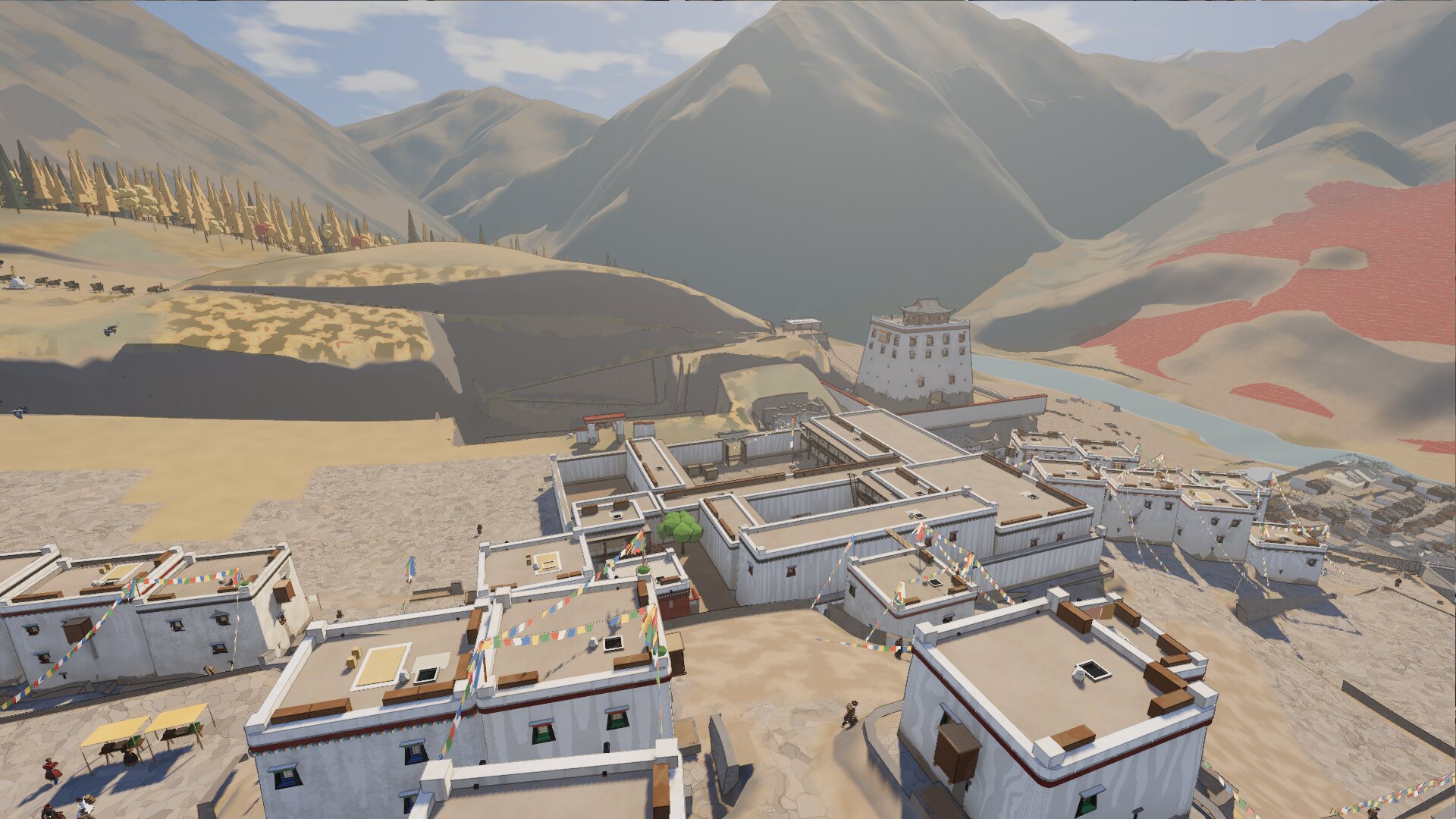 The rooftops of Dungkardo, a Tibetan border town built in Godot, under prayer flags with mountains behind