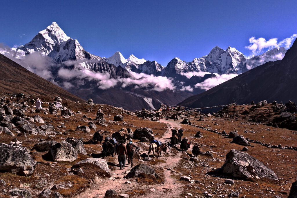 High valley trail under snow peaks, Everest Base Camp