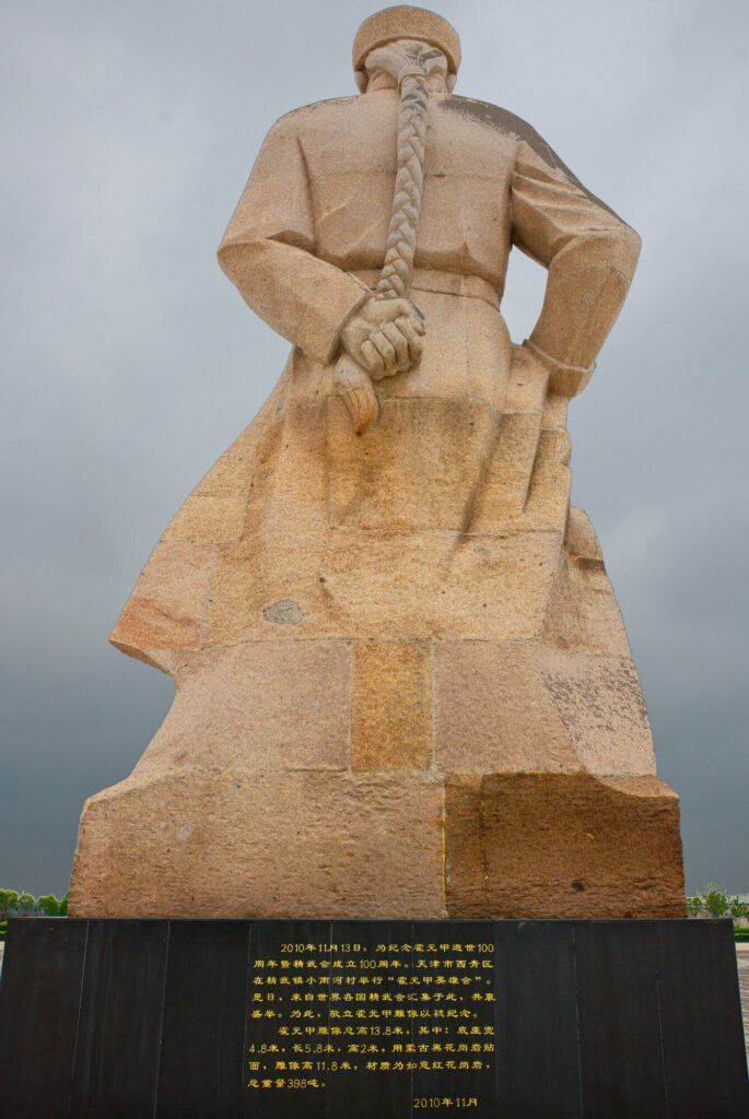 The statue from behind, queue braid down its back, Huo Yuanjia Memorial Park
