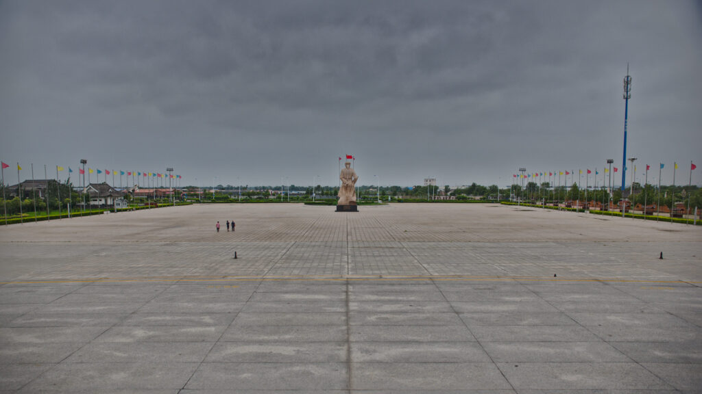 The empty square of the Huo Yuanjia memorial park outside Tianjin, his statue small in the distance
