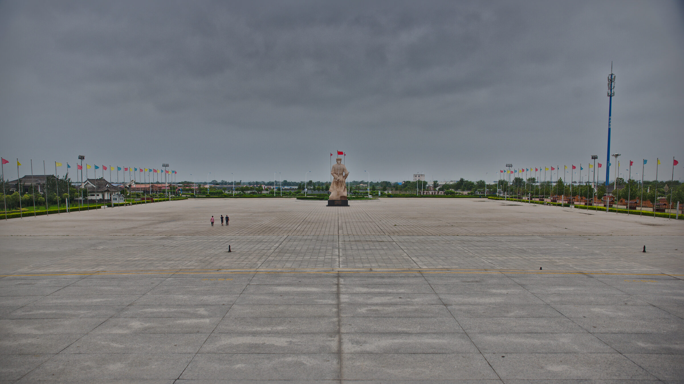 The empty square of the Huo Yuanjia memorial park outside Tianjin, his statue small in the distance