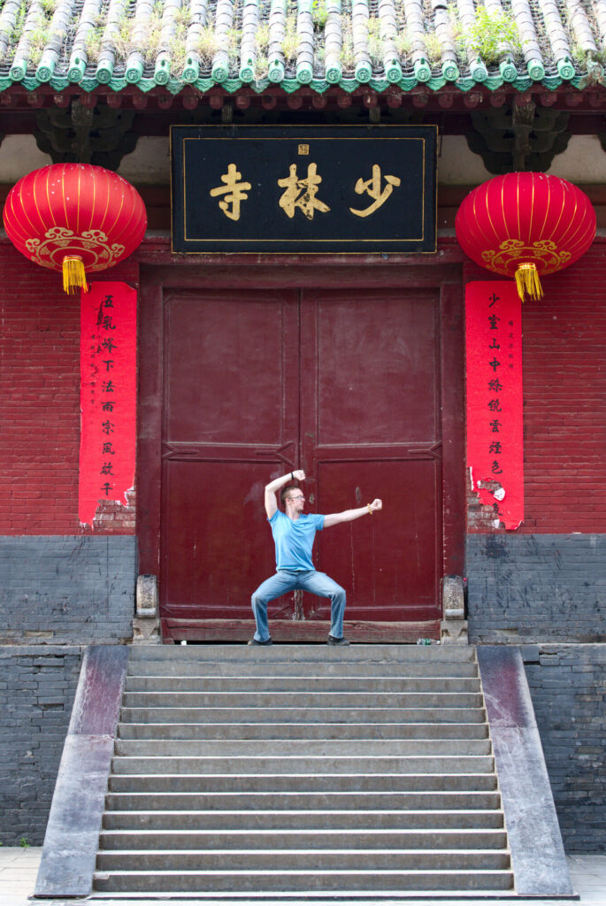 Greg in stance before the Shaolin gate, Shaolin Temple