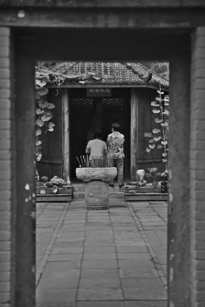 Courtyard shrine through a doorway, black and white, Tanzhe Temple