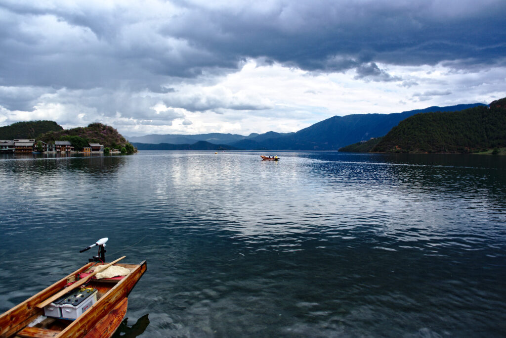Lugu Lake with a moored boat, Yunnan: Kunming to Shangri-La